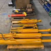 Rebuilt yellow hydraulic cylinders on pallets