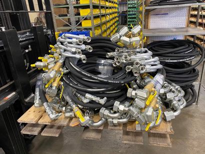 Pallet of finished hose assemblies with valves and fittings