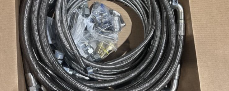 Coiled braided lines and bagged components packed in a box