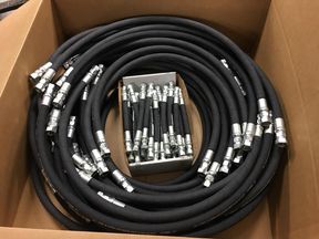 Boxed kit of black hydraulic hose assemblies with fittings